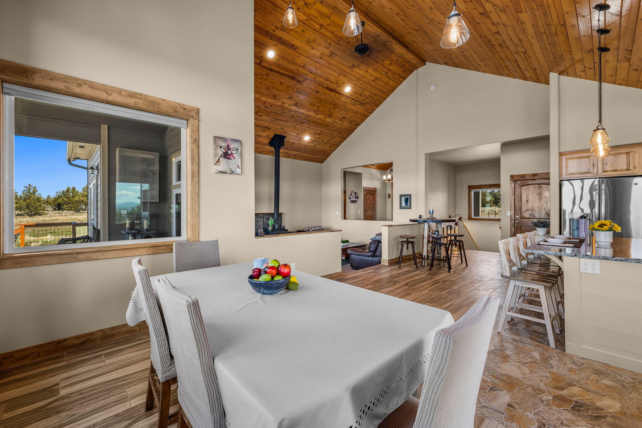 6040 Gravett Road Prineville, OR 97754 - Photo 8 of 77 a view of a dining room with furniture and wooden floor