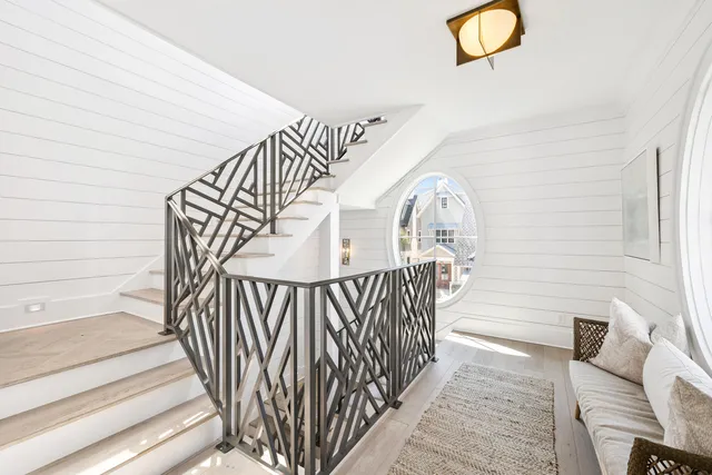a living room with furniture fireplace and window