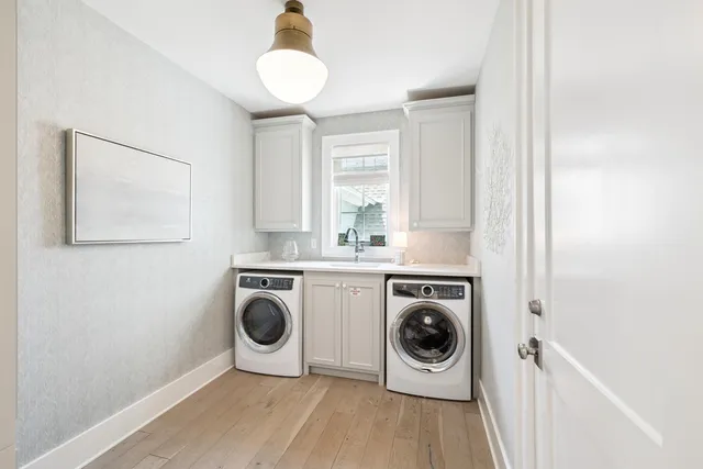 a front view of a residential apartment building with a yard