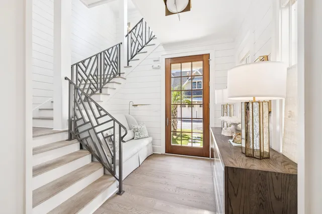 a kitchen with a sink stove and white cabinets