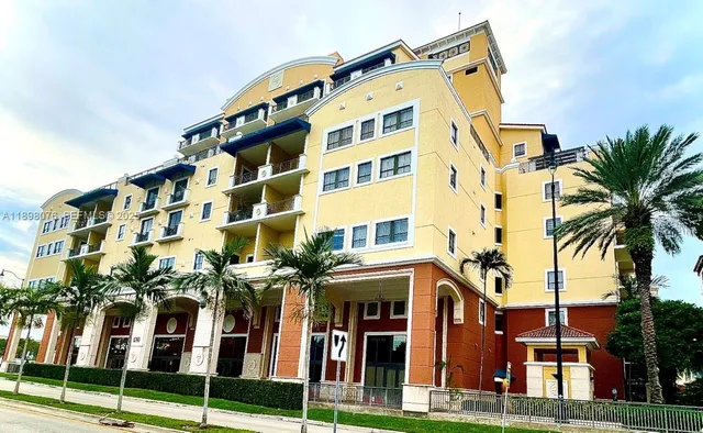 a view of a street with a house on the side