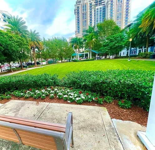 a lobby with furniture and a rug