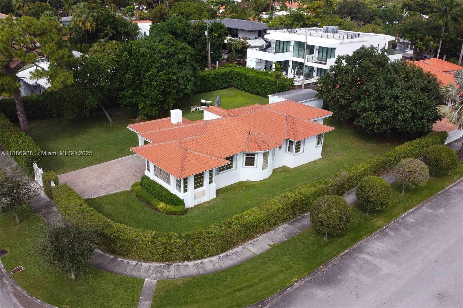 an aerial view of a house with outdoor space pool patio and lake view