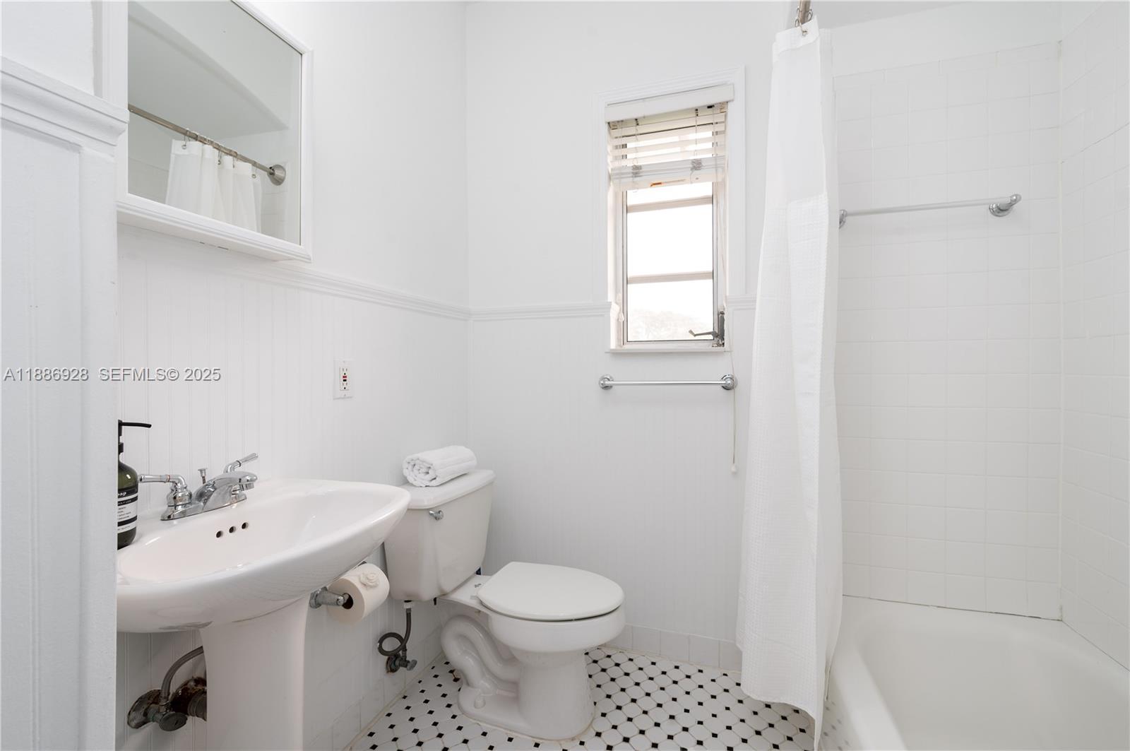 501 Southwest 24th Road, Unit 501 Miami, FL 33129 - Photo 20 of 29 a bathroom with a sink toilet and mirror