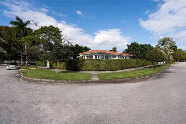 a view of a golf course with a house