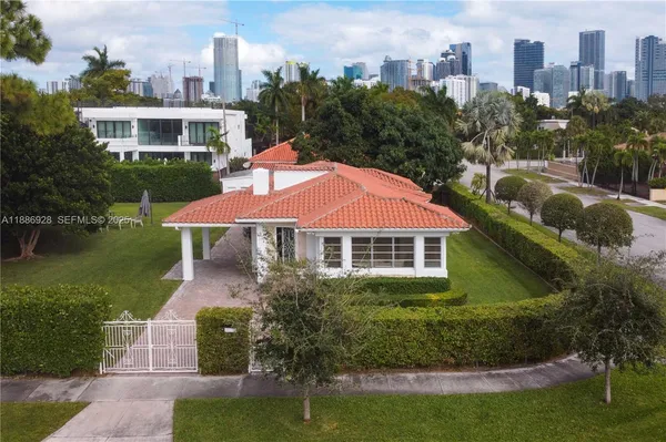 an aerial view of a house with outdoor space lake lake and outdoor seating