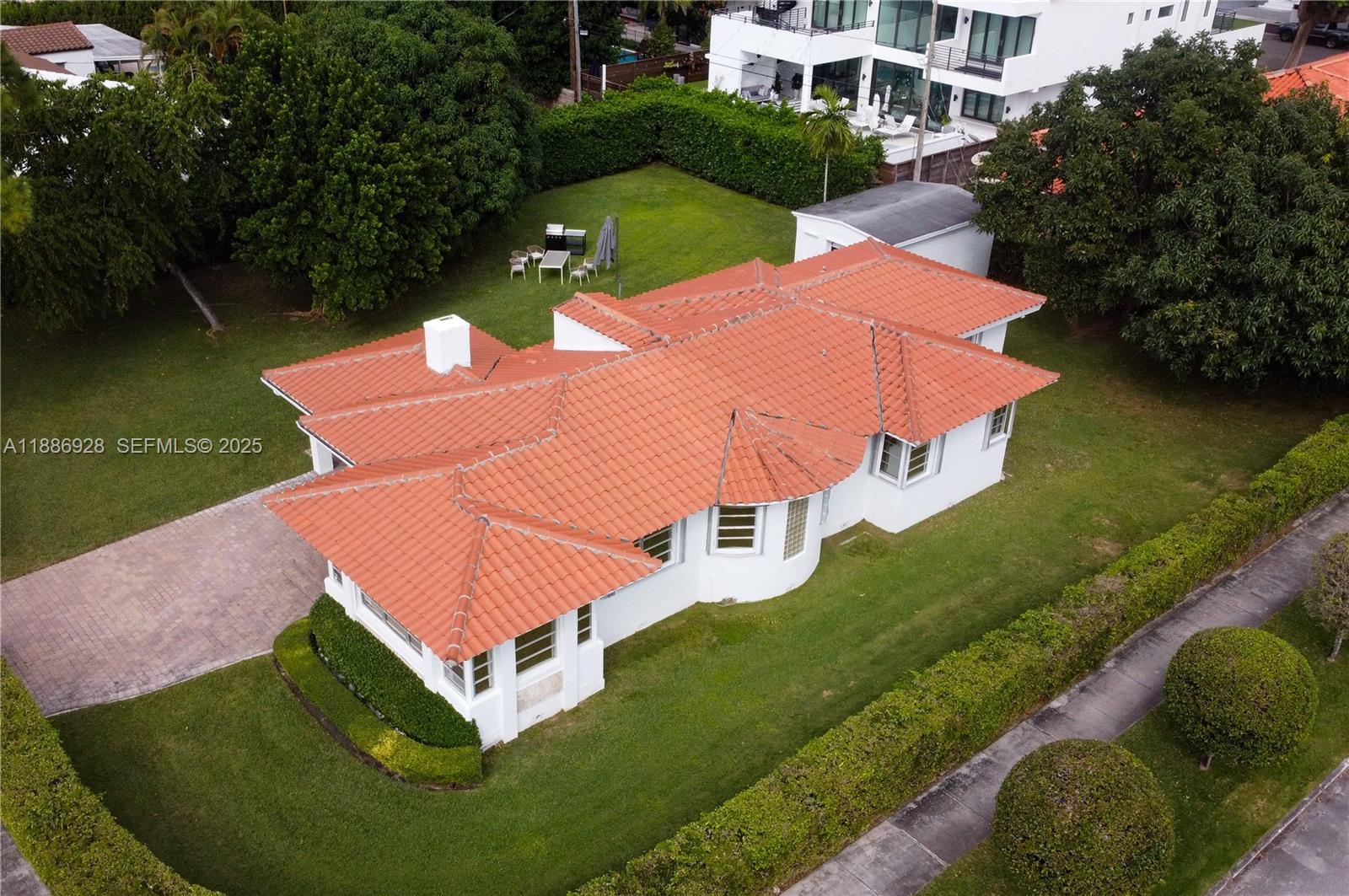 501 Southwest 24th Road, Unit 501 Miami, FL 33129 - Photo 27 of 29 an aerial view of a house with outdoor space lake lake and outdoor seating