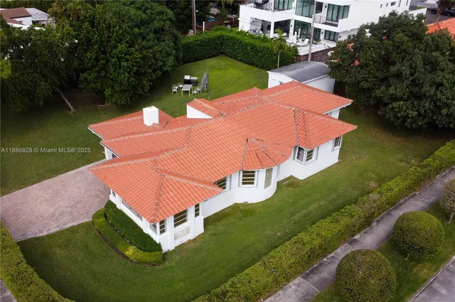 an aerial view of a house with a lake view