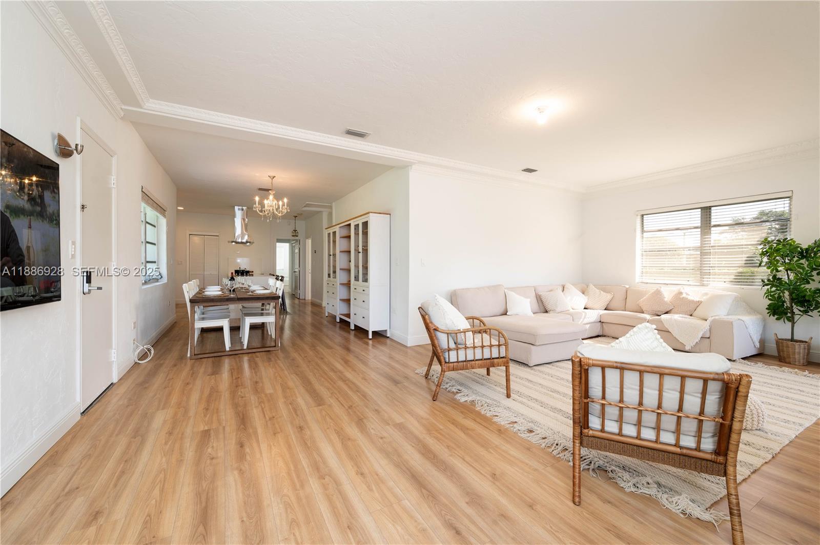 501 Southwest 24th Road, Unit 501 Miami, FL 33129 - Photo 6 of 29 a living room with furniture and a wooden floor