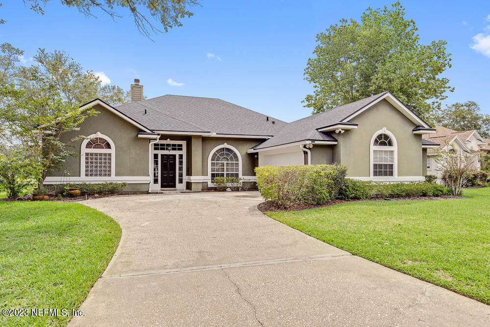 332 Maplewood Drive St. Johns, FL 32259 - Photo 2 of 35 a view of a yard in front of a house with green space