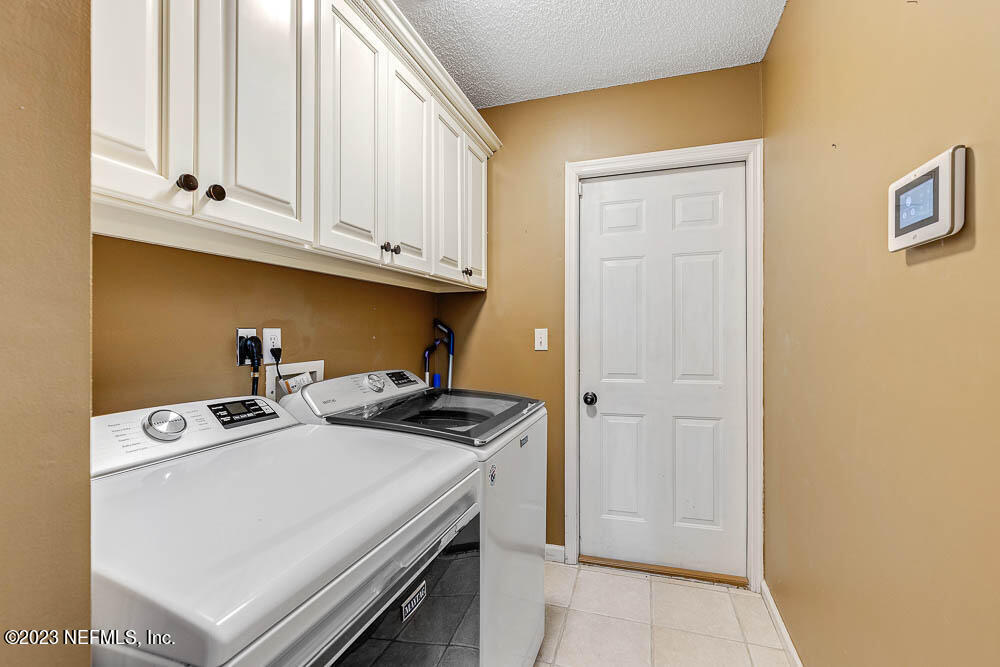 332 Maplewood Drive St. Johns, FL 32259 - Photo 25 of 35 a utility room with dryer and washer