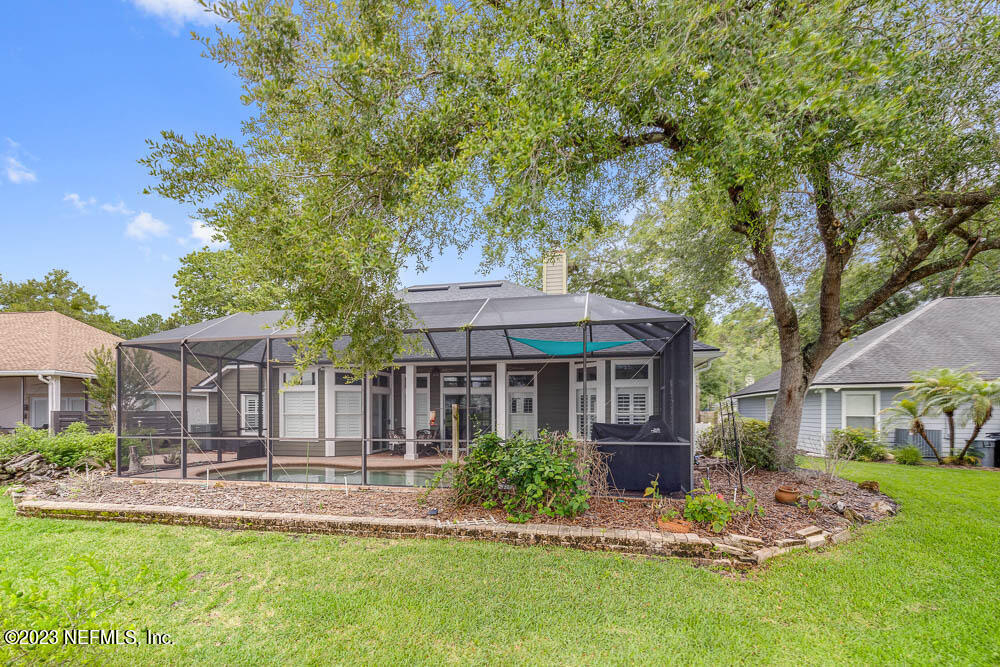 332 Maplewood Drive St. Johns, FL 32259 - Photo 27 of 35 a view of a house with a yard