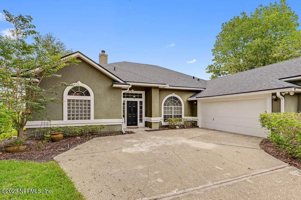 332 Maplewood Drive St. Johns, FL 32259 - Photo 3 of 35 a front view of a house with a yard