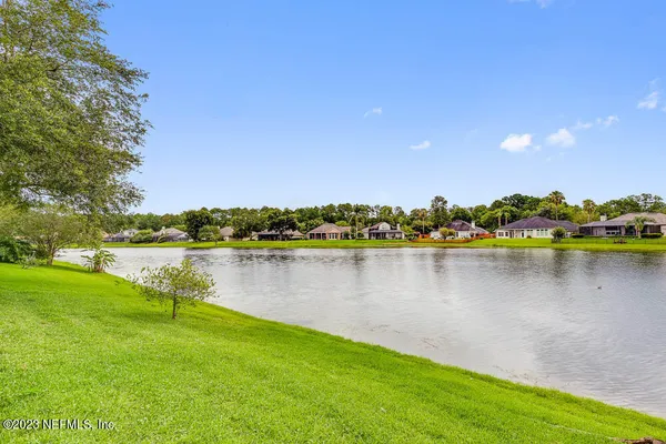 a view of a lake with a big yard