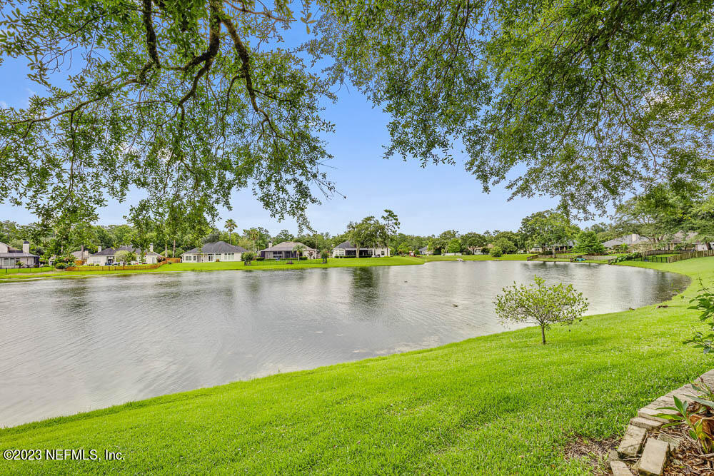 332 Maplewood Drive St. Johns, FL 32259 - Photo 34 of 35 a view of a lake with a big yard