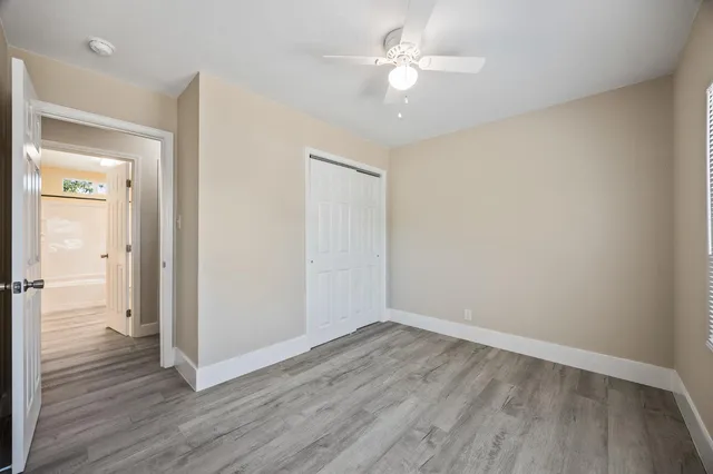 a view of a room with wooden floor
