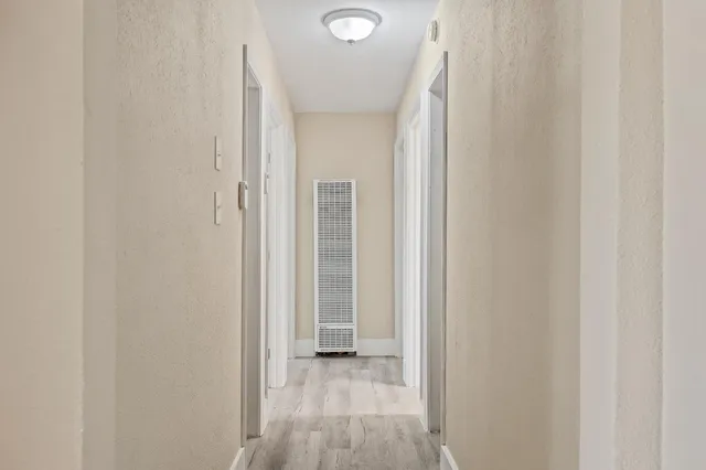 a view of a livingroom from a hallway