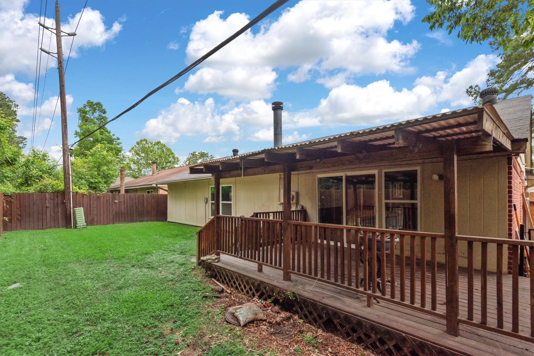 6510 Barrygate Drive Spring, TX 77373 - Photo 25 of 25 a view of a house with a small yard and wooden fence