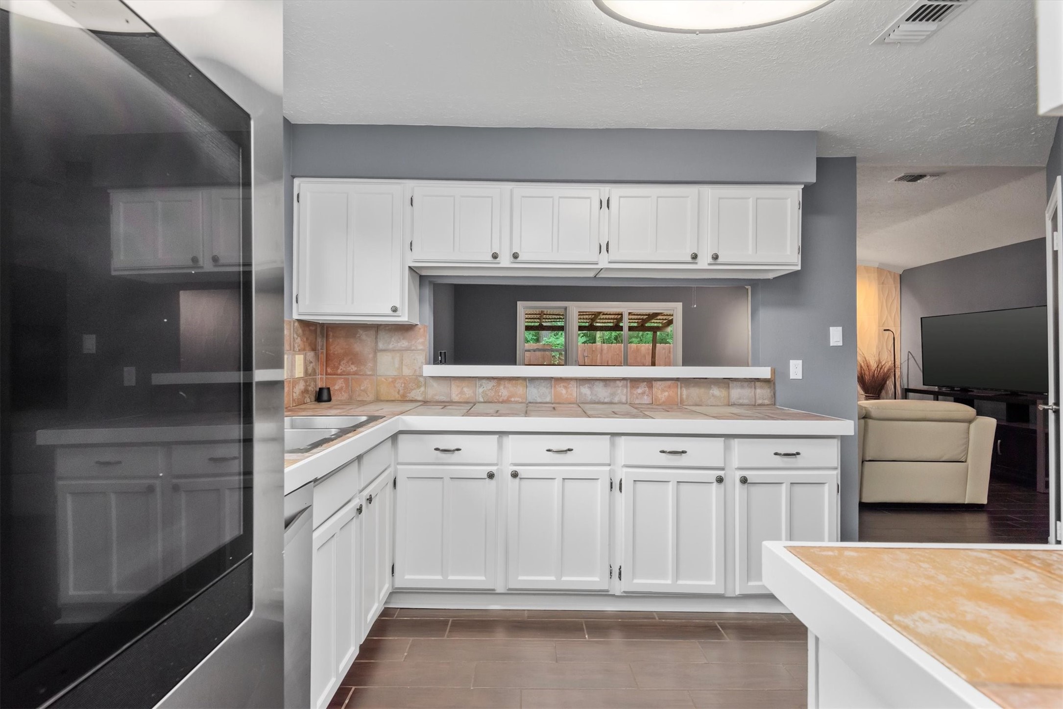 6510 Barrygate Drive Spring, TX 77373 - Photo 6 of 25 a kitchen with cabinets and window