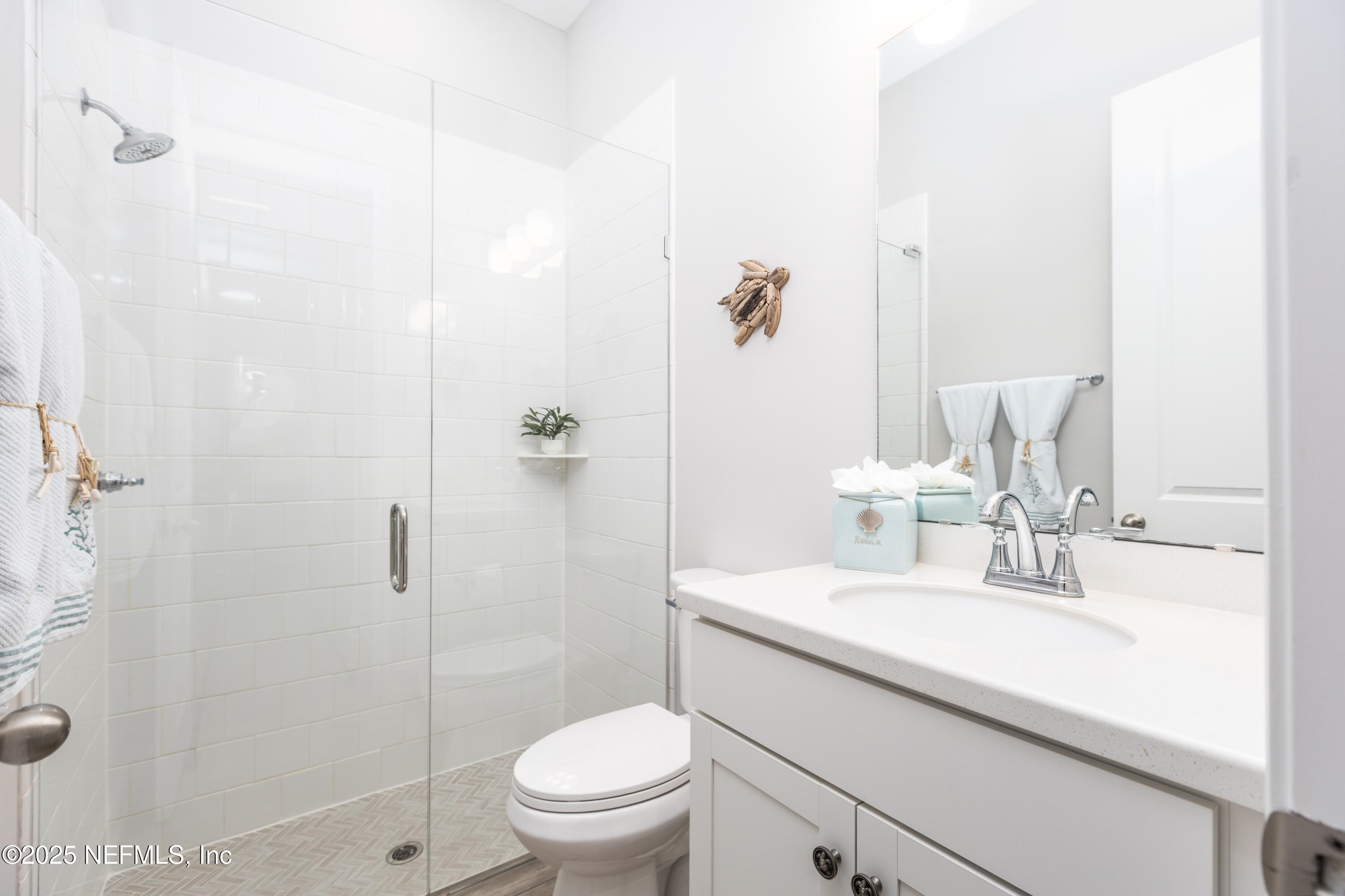 103 Tarbert Lane St. Augustine, FL 32092 - Photo 14 of 44 a bathroom with a sink a toilet and shower