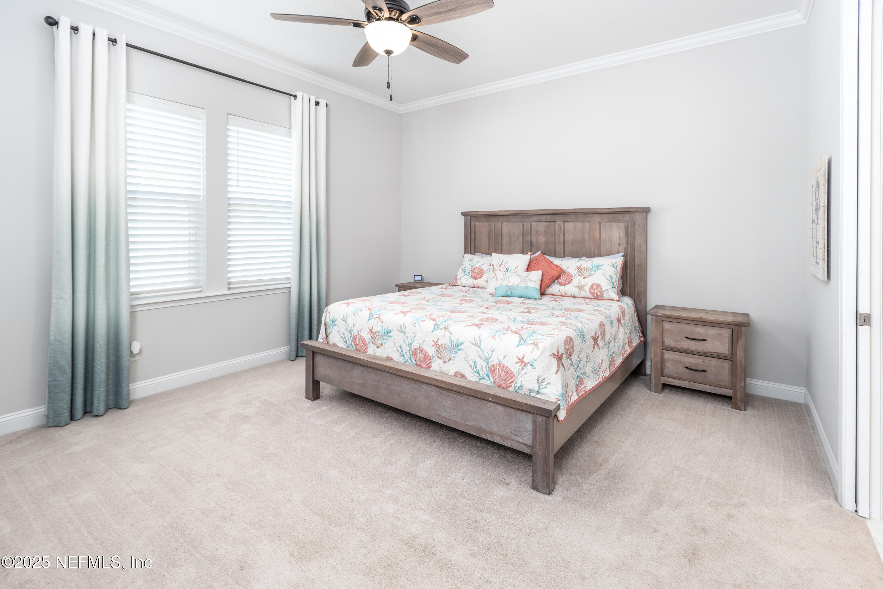 103 Tarbert Lane St. Augustine, FL 32092 - Photo 15 of 44 a bedroom with a bed lamp and a chandelier