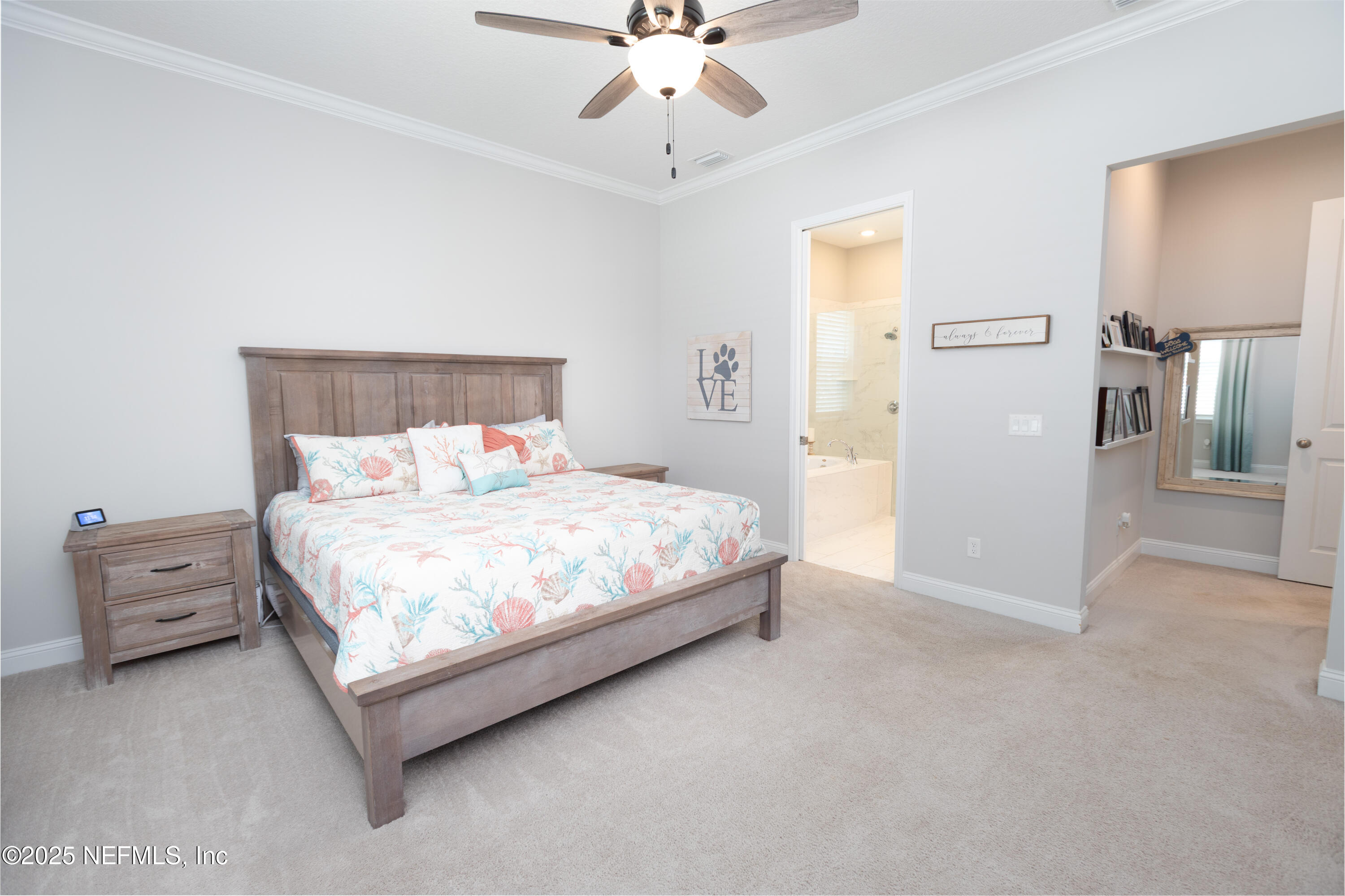 103 Tarbert Lane St. Augustine, FL 32092 - Photo 16 of 44 a bedroom with a bed and a chandelier