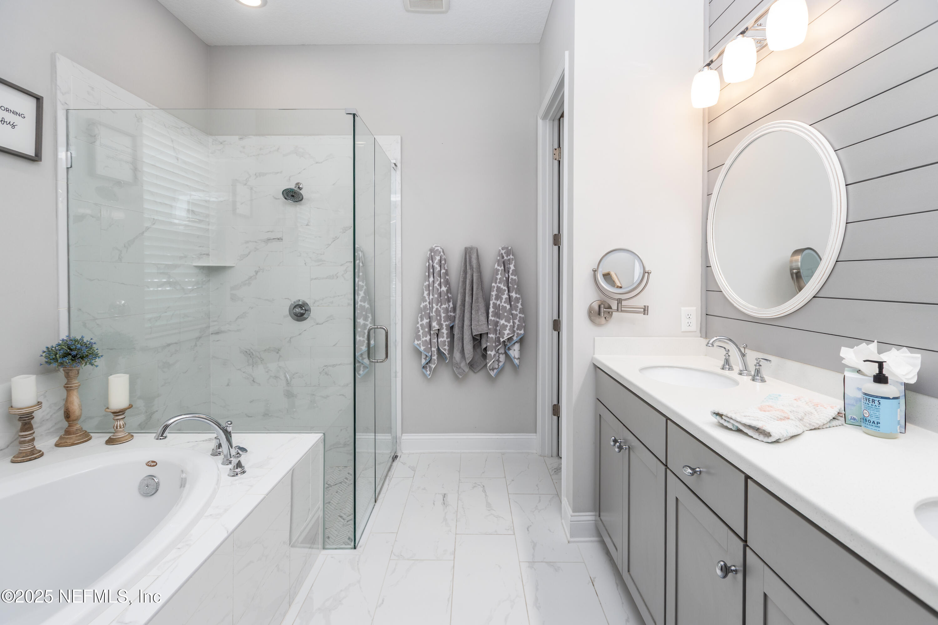 103 Tarbert Lane St. Augustine, FL 32092 - Photo 18 of 44 a spacious bathroom with a tub sink and mirror