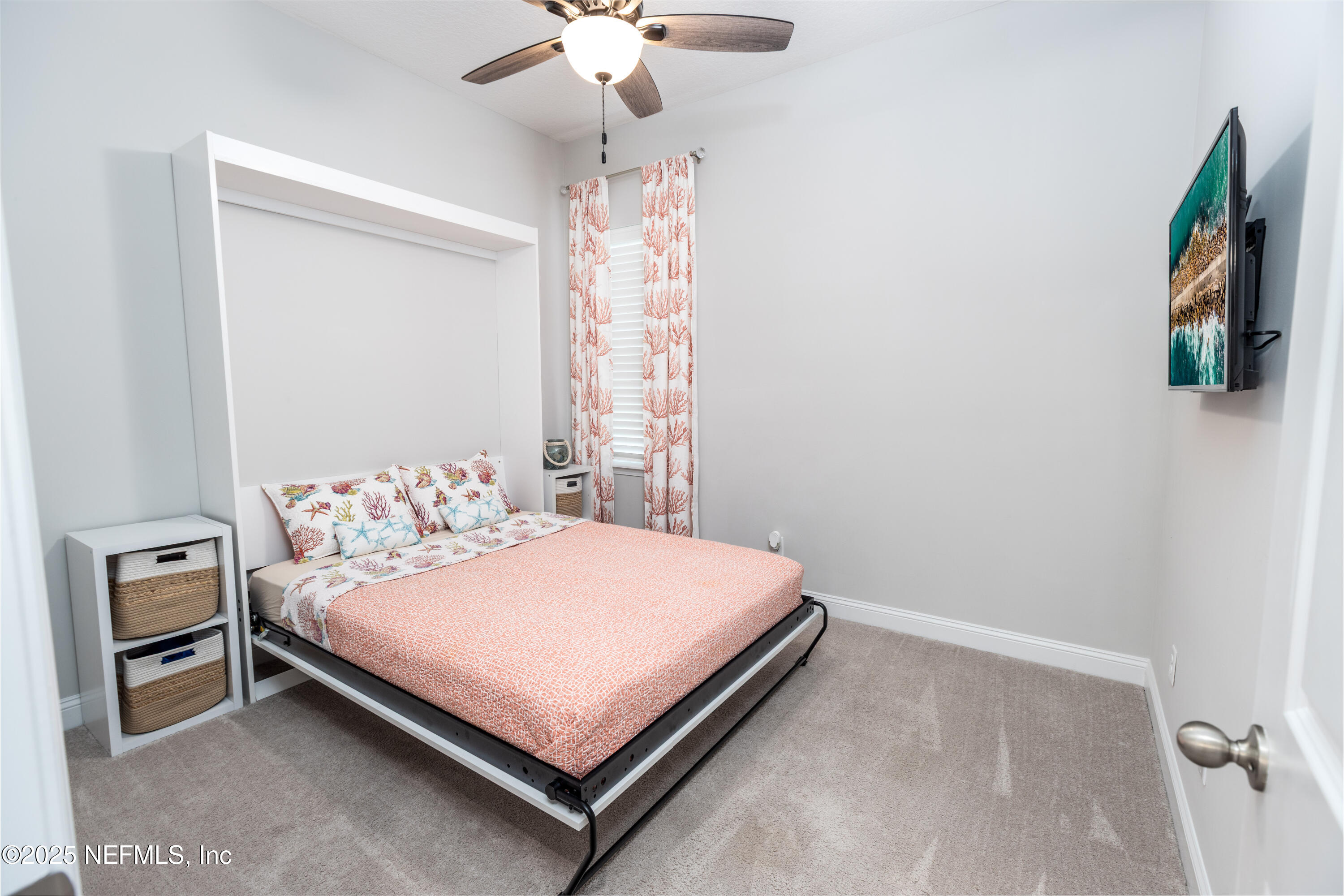 103 Tarbert Lane St. Augustine, FL 32092 - Photo 23 of 44 a bedroom with a bed and a chandelier