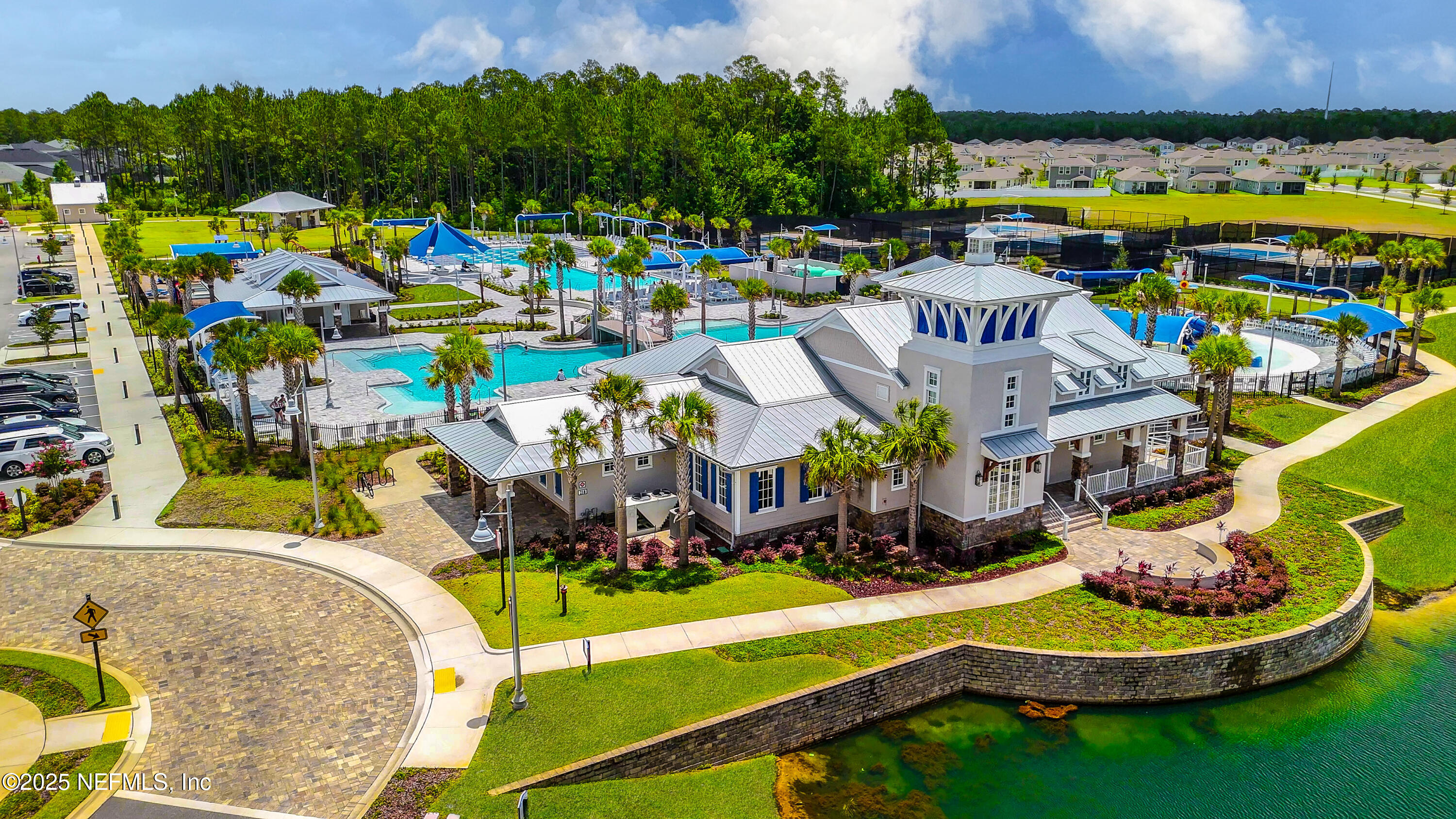 103 Tarbert Lane St. Augustine, FL 32092 - Photo 36 of 44 a group of people sitting in a swimming pool with an outdoor seating