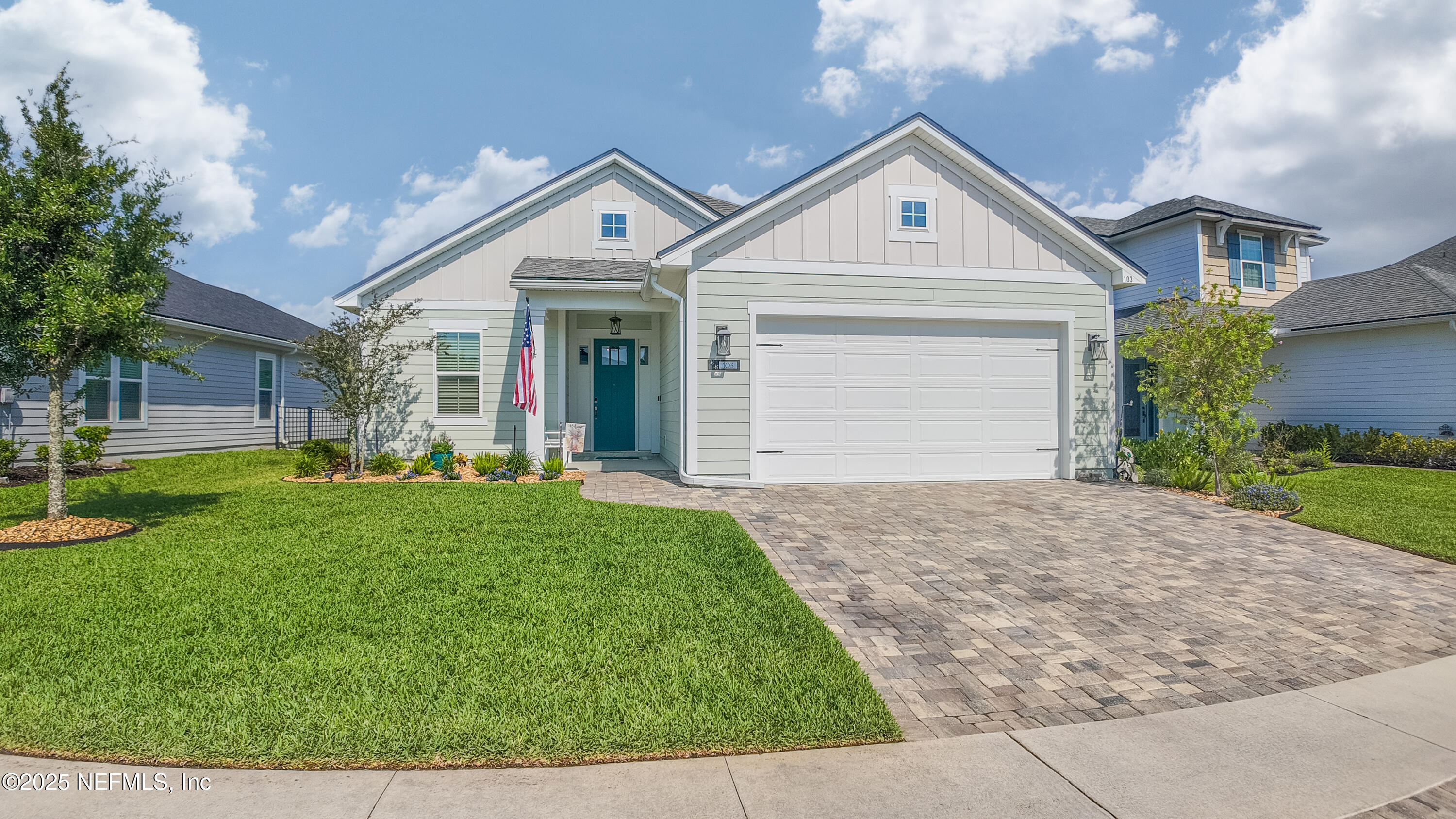 103 Tarbert Lane St. Augustine, FL 32092 - Photo 4 of 44 a front view of a house with a yard and garage
