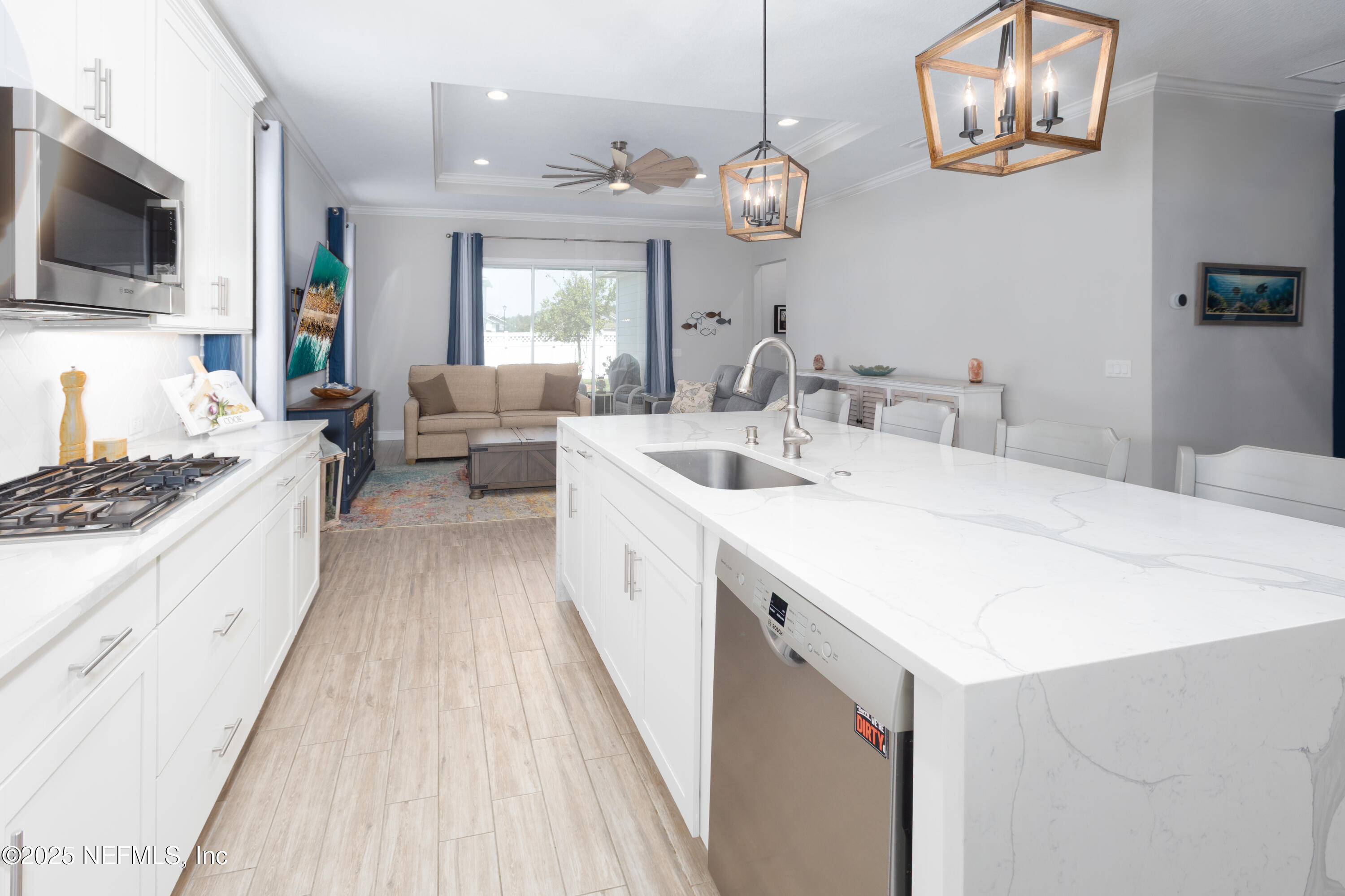 103 Tarbert Lane St. Augustine, FL 32092 - Photo 7 of 44 a large white kitchen with a large window