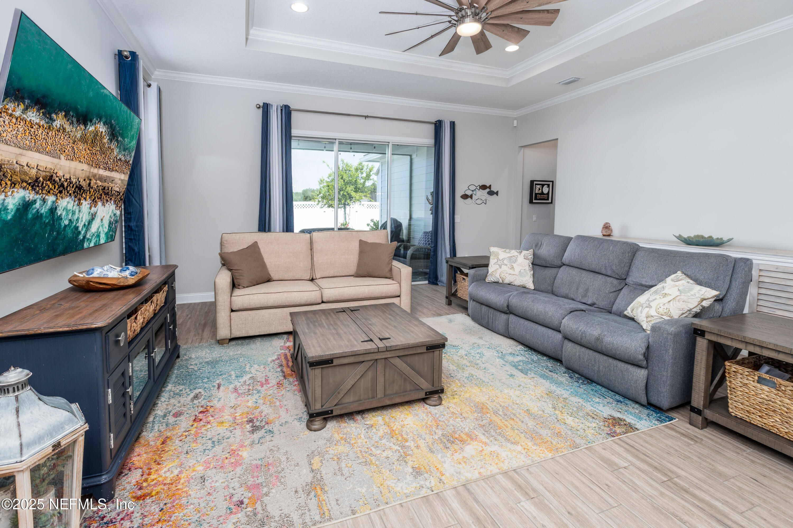 103 Tarbert Lane St. Augustine, FL 32092 - Photo 10 of 44 a living room with furniture and a large window