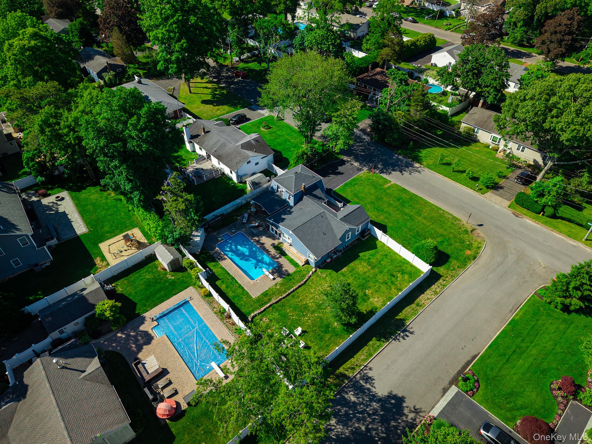 33 Lillian Road Nesconset, NY 11767 - Photo 40 of 42 Aerial View Showing The Large Corner Property With A Very Large, Fully PVC Fenced Backyard & The Saltwater In Ground Pool.