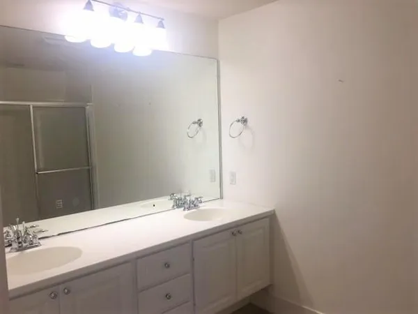 a bathroom with a sink and mirror