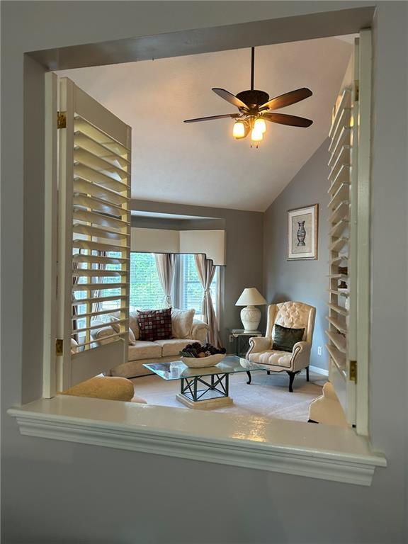 4197 Wyndham Ridge Court Northeast Buford, GA 30519 - Photo 11 of 49 a living room with furniture and chandelier