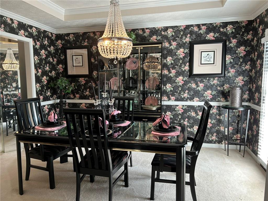 4197 Wyndham Ridge Court Northeast Buford, GA 30519 - Photo 12 of 49 a view of a dining room with furniture and chandelier