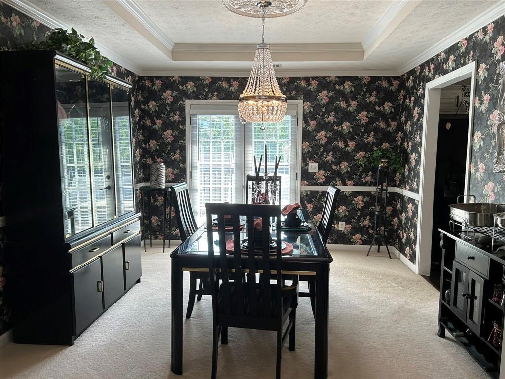 4197 Wyndham Ridge Court Northeast Buford, GA 30519 - Photo 15 of 49 a view of a dining room with furniture window and outside view