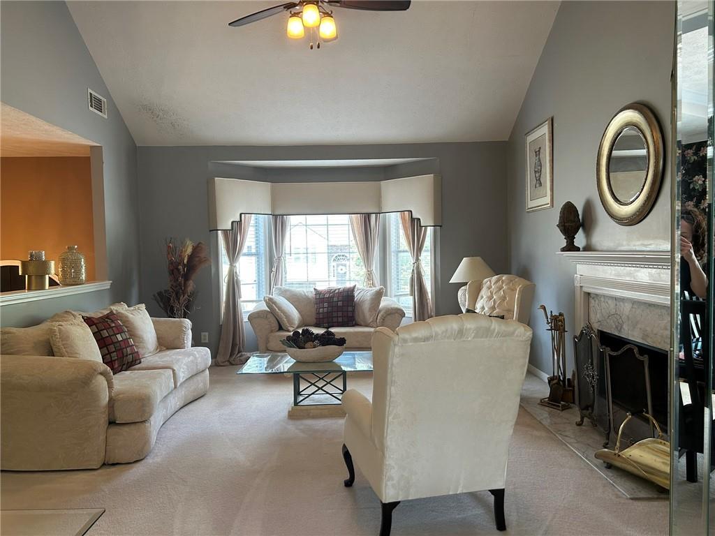 4197 Wyndham Ridge Court Northeast Buford, GA 30519 - Photo 17 of 49 a living room with furniture and a fireplace