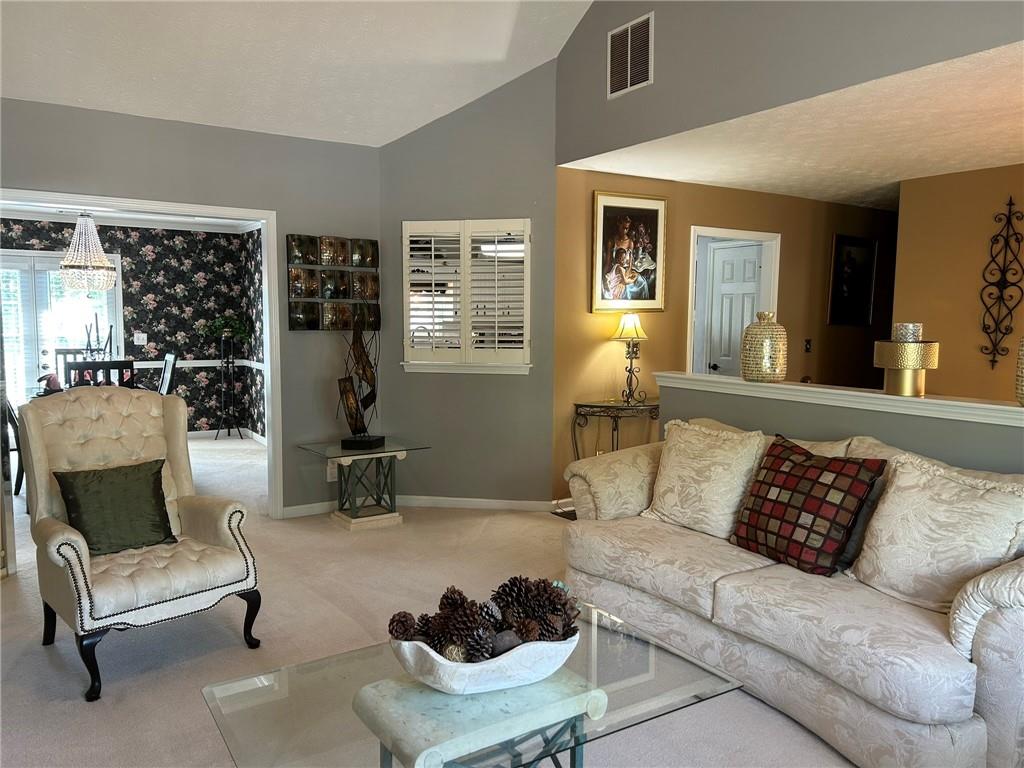4197 Wyndham Ridge Court Northeast Buford, GA 30519 - Photo 19 of 49 a living room with furniture and a large window