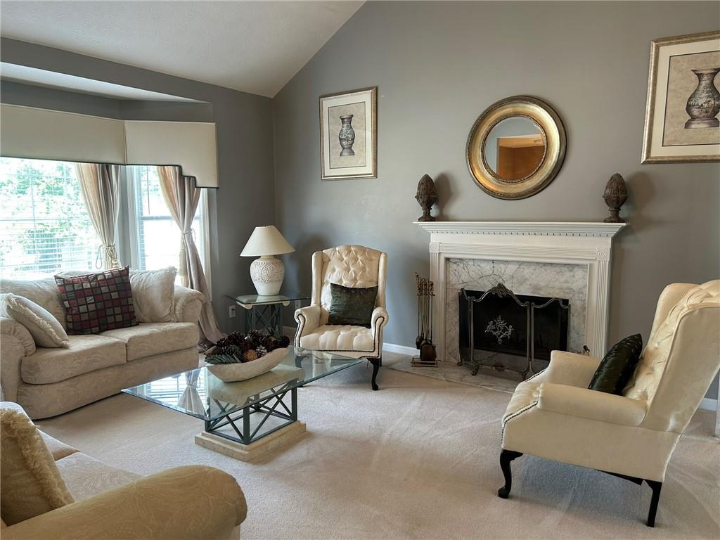 4197 Wyndham Ridge Court Northeast Buford, GA 30519 - Photo 20 of 49 a living room with furniture and a fireplace