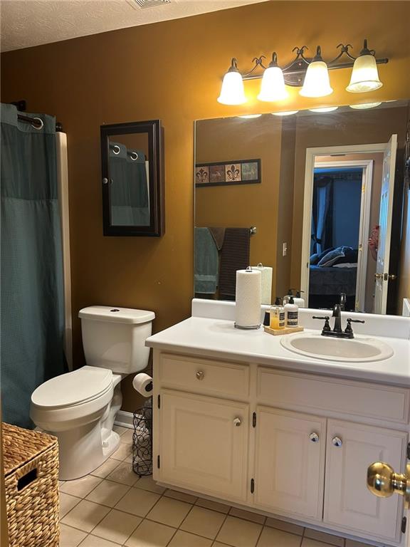 4197 Wyndham Ridge Court Northeast Buford, GA 30519 - Photo 24 of 49 a bathroom with a sink a toilet and mirror