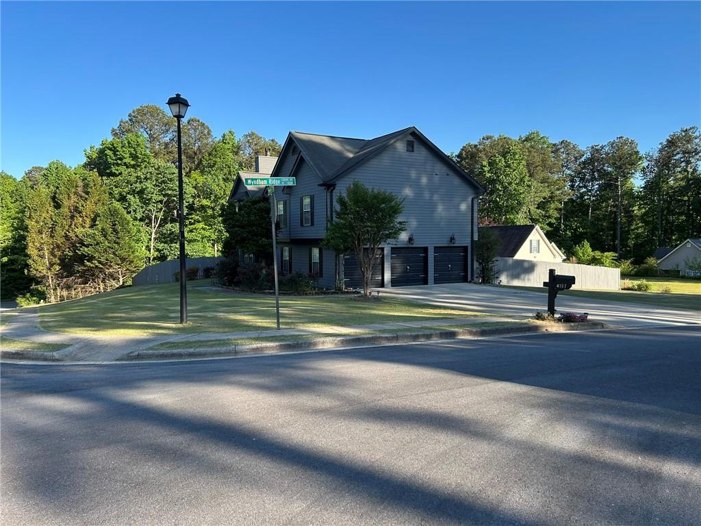 4197 Wyndham Ridge Court Northeast Buford, GA 30519 - Photo 3 of 49 a view of a house with a swimming pool