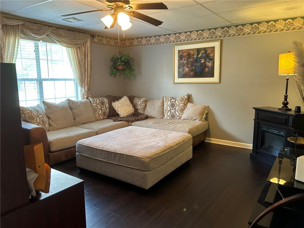 4197 Wyndham Ridge Court Northeast Buford, GA 30519 - Photo 39 of 49 a living room with furniture and a flat screen tv