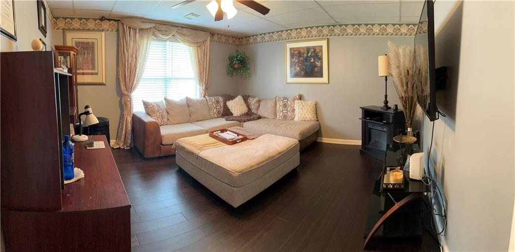 4197 Wyndham Ridge Court Northeast Buford, GA 30519 - Photo 40 of 49 a living room with furniture and a window