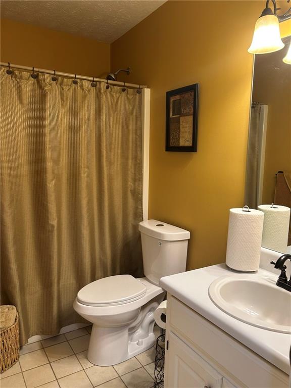4197 Wyndham Ridge Court Northeast Buford, GA 30519 - Photo 41 of 49 a white toilet sitting next to a bathroom sink