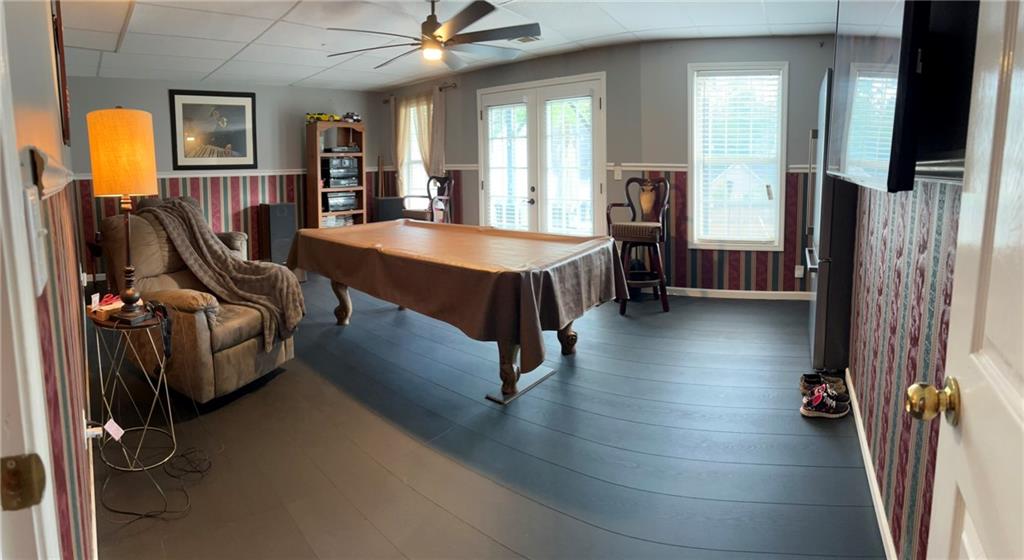 4197 Wyndham Ridge Court Northeast Buford, GA 30519 - Photo 42 of 49 a view of a livingroom with furniture and a flat screen tv