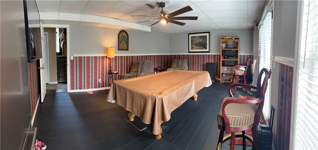 4197 Wyndham Ridge Court Northeast Buford, GA 30519 - Photo 43 of 49 a bed room with a bed and a chandelier