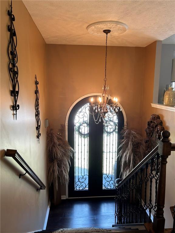 4197 Wyndham Ridge Court Northeast Buford, GA 30519 - Photo 6 of 49 a view of a hallway with couches and a chandelier