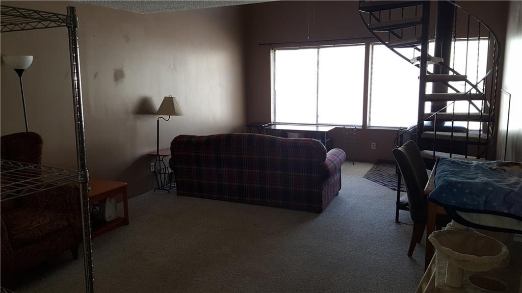 860 Copper Road, Unit 105 Copper Mountain, CO 80443 - Photo 14 of 23 a living room with furniture and a window