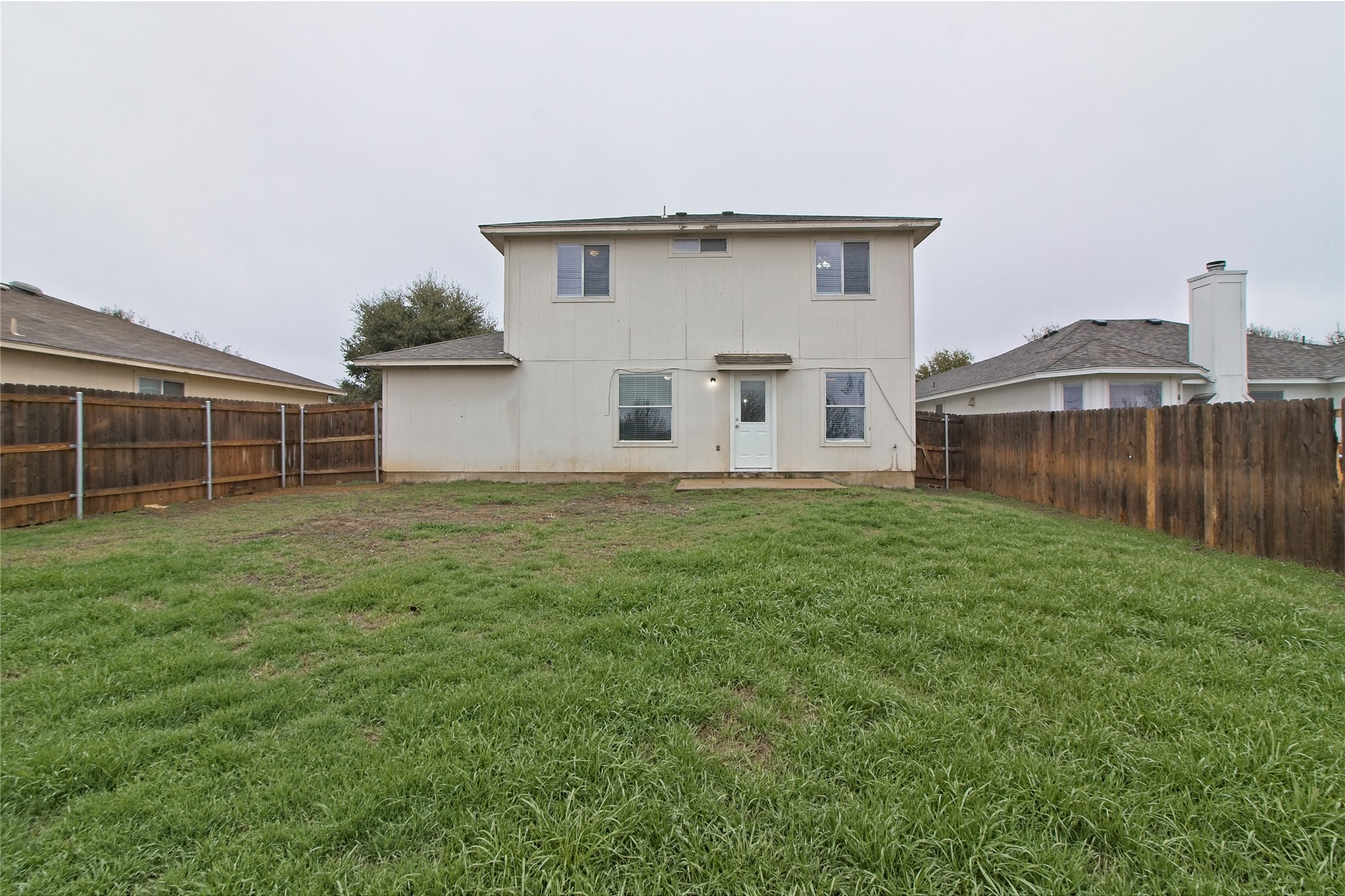 232 Brickyard Lane Jarrell, TX 76537 - Photo 26 of 31 A private, fenced backyard offers ample green space and direct house access.